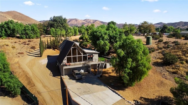 birds eye view of property featuring a rural view and a mountain view