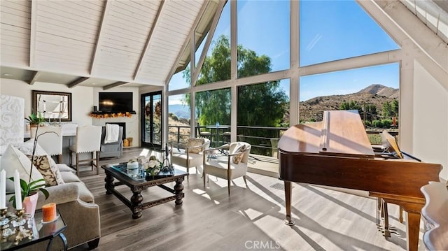 sunroom / solarium with wood ceiling and vaulted ceiling with beams