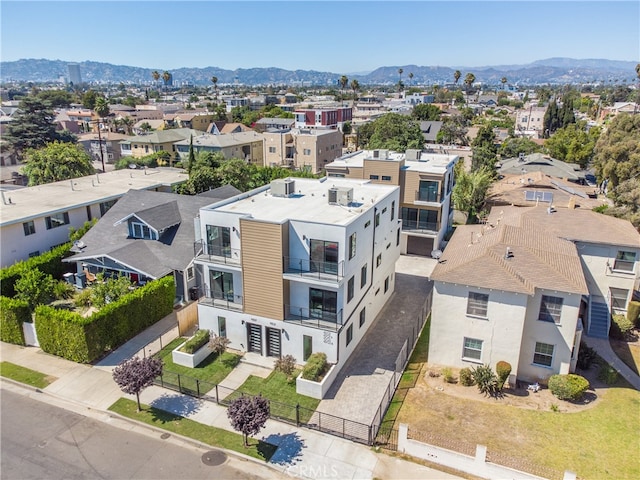 birds eye view of property featuring a mountain view