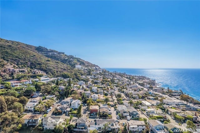 birds eye view of property with a water and mountain view