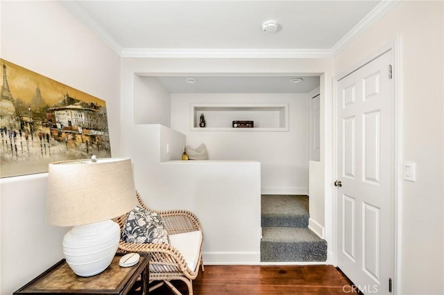 hall with ornamental molding and dark hardwood / wood-style floors