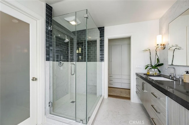 bathroom with vanity and walk in shower