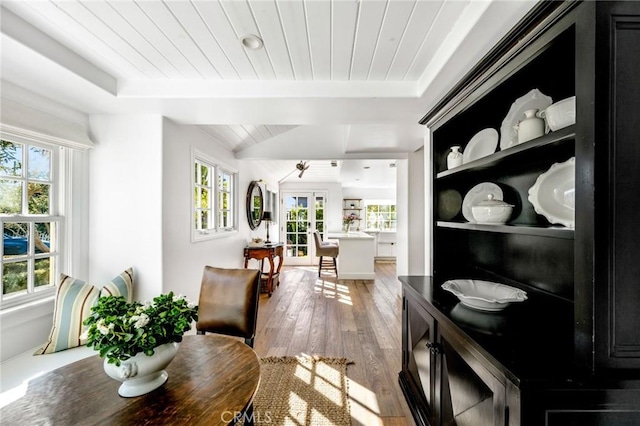 dining room with french doors, lofted ceiling, hardwood / wood-style floors, and wooden ceiling