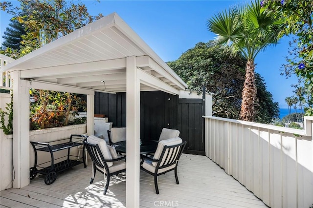 wooden terrace featuring a gazebo