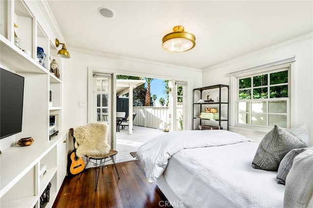 bedroom featuring access to exterior, wood-type flooring, and ornamental molding