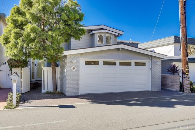 view of front of property with a garage