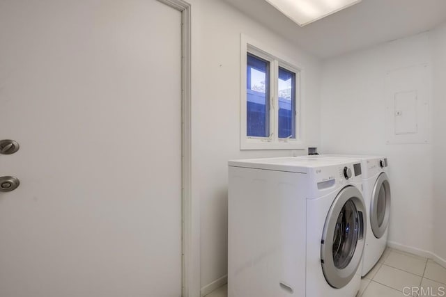 washroom featuring washer and dryer and light tile patterned floors