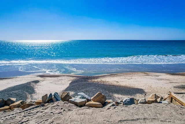 property view of water featuring a view of the beach