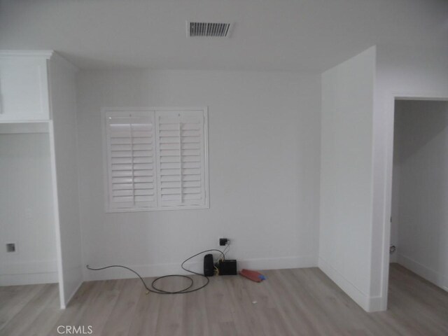 laundry area featuring light hardwood / wood-style floors