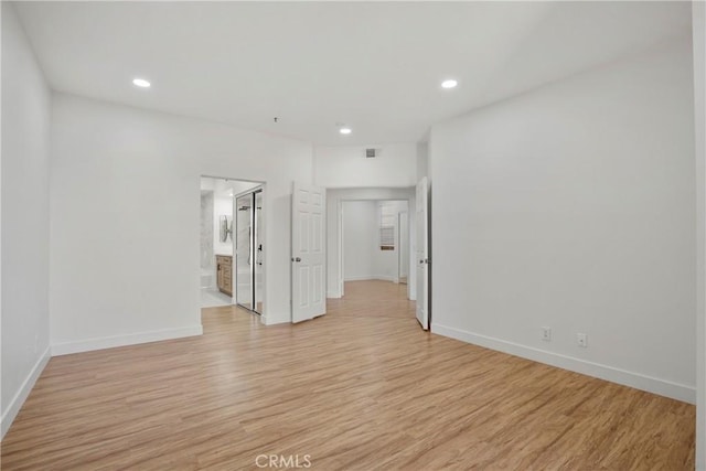 unfurnished room with light hardwood / wood-style floors