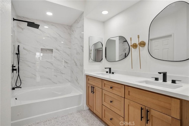 bathroom with tiled shower / bath, vanity, and tile patterned flooring