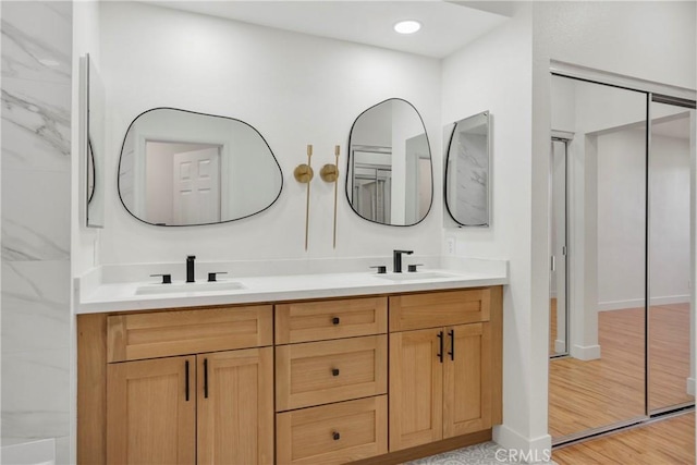 bathroom featuring vanity and hardwood / wood-style flooring