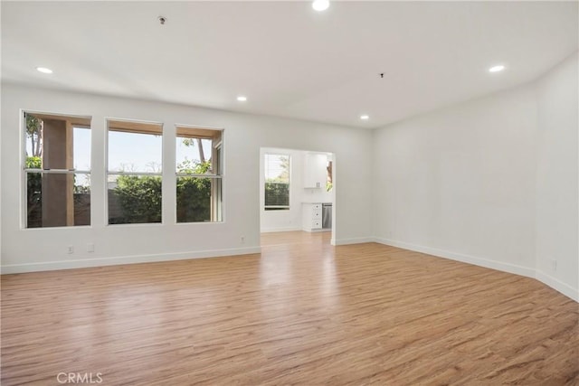 unfurnished room featuring light hardwood / wood-style floors