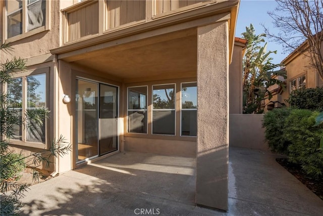 doorway to property with a patio area