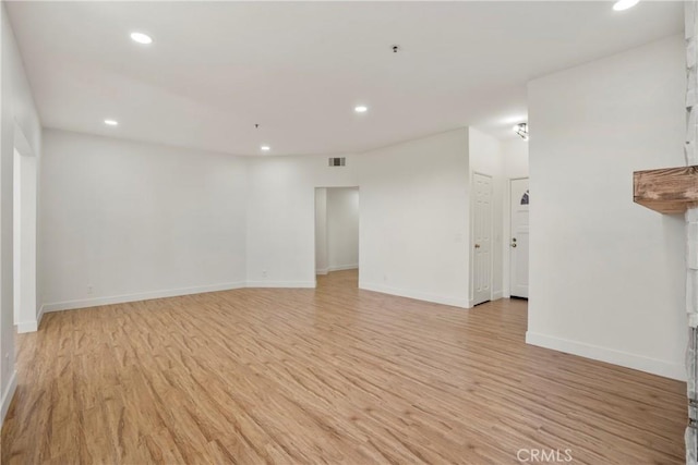 unfurnished room featuring light hardwood / wood-style floors