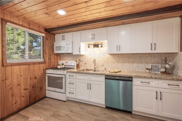 kitchen featuring sink, light wood-type flooring, white cabinets, light stone countertops, and white appliances