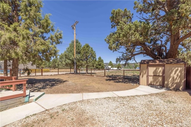 view of yard with a storage unit