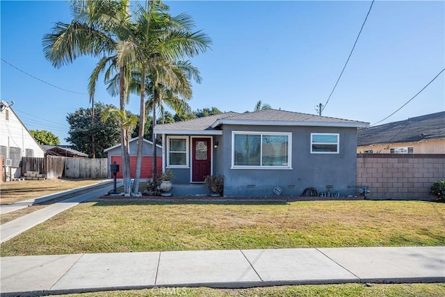 bungalow-style house featuring a front yard