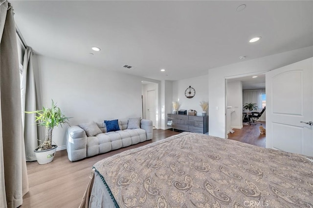 bedroom with light hardwood / wood-style floors