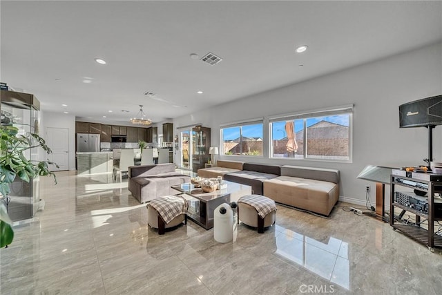 living room with an inviting chandelier