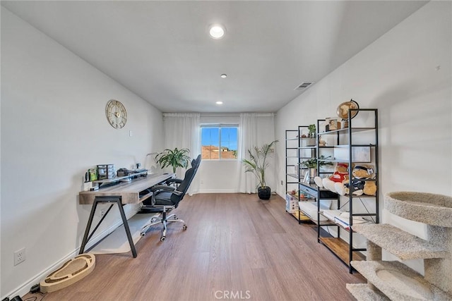 office area with hardwood / wood-style flooring