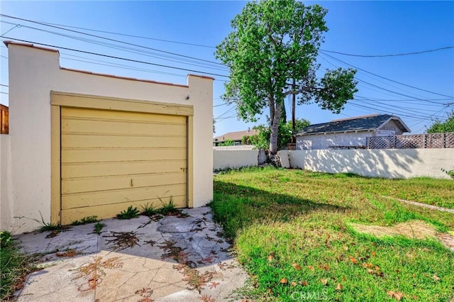 garage with a lawn