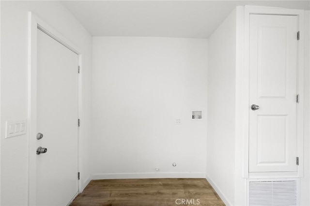 washroom featuring dark hardwood / wood-style flooring and washer hookup