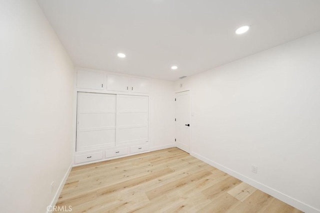 spare room featuring light hardwood / wood-style flooring