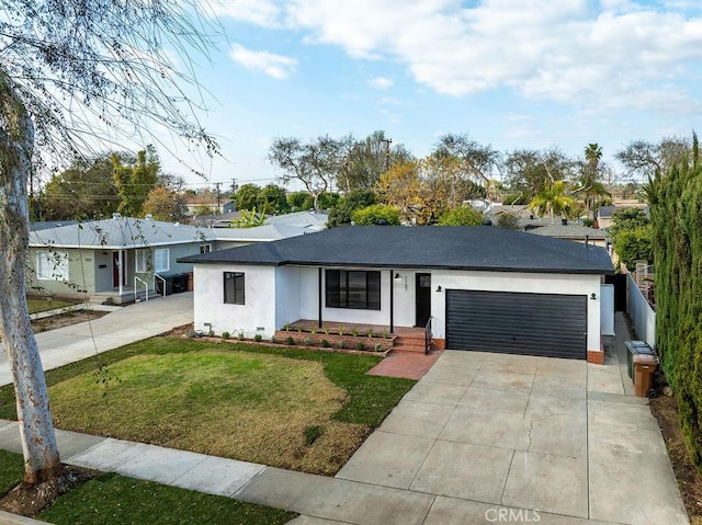 ranch-style home with a garage and a front yard