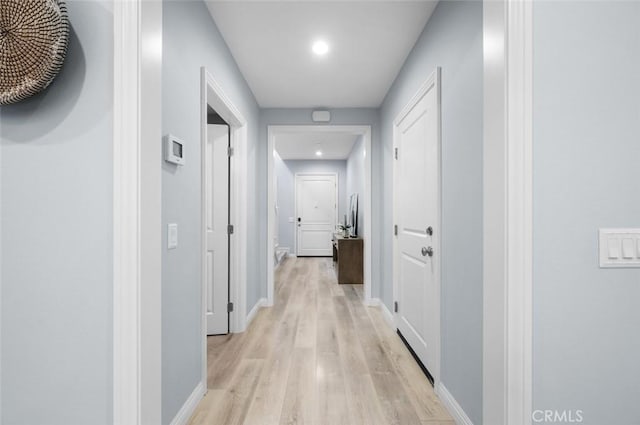 hall with light hardwood / wood-style flooring