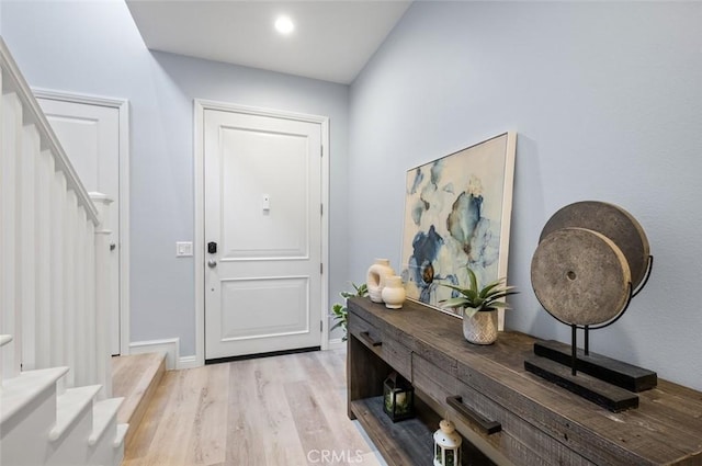 entryway with light hardwood / wood-style floors