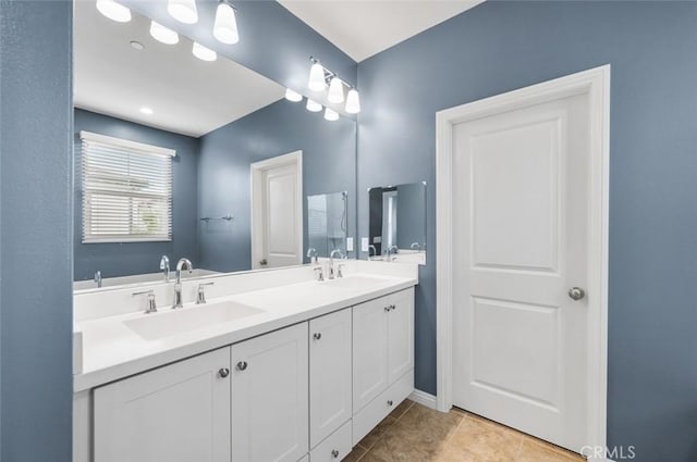 bathroom with tile patterned floors and vanity