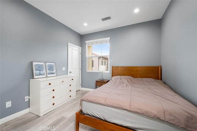 bedroom with light hardwood / wood-style floors