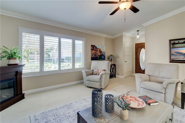 carpeted living room featuring crown molding, ceiling fan, and plenty of natural light