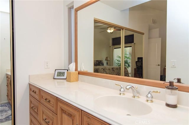 bathroom featuring ceiling fan and vanity