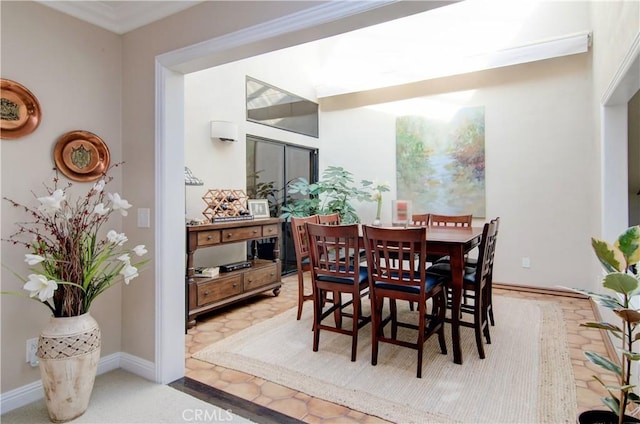 dining room featuring crown molding