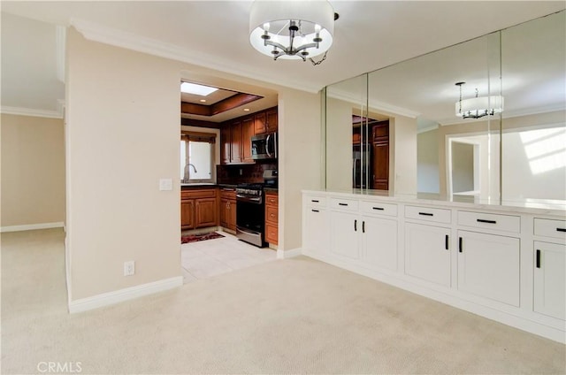 kitchen featuring light colored carpet, white cabinetry, hanging light fixtures, appliances with stainless steel finishes, and brown cabinets