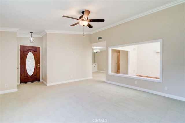 interior space featuring baseboards, visible vents, ornamental molding, and light colored carpet