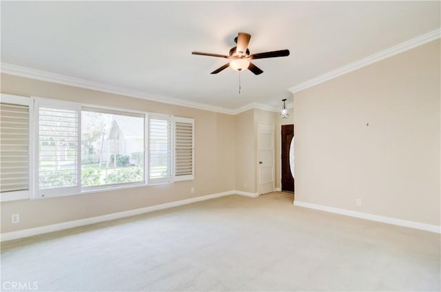 unfurnished room featuring light carpet, ceiling fan, ornamental molding, and baseboards