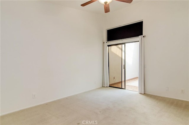 interior space featuring a ceiling fan, access to outside, and light colored carpet