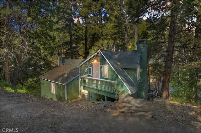 exterior space featuring a wooden deck