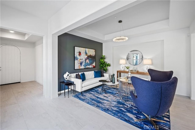 living room with a tray ceiling