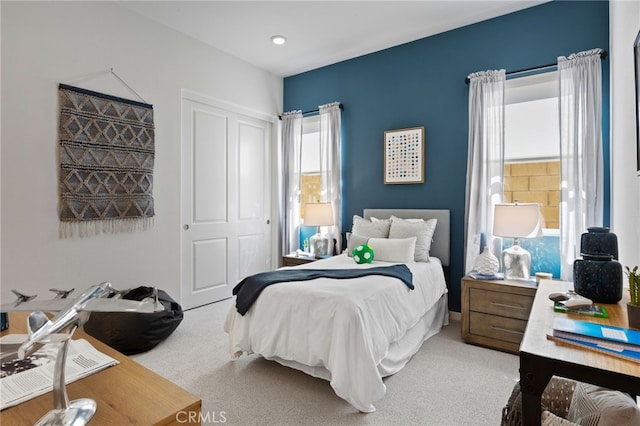 carpeted bedroom featuring a closet