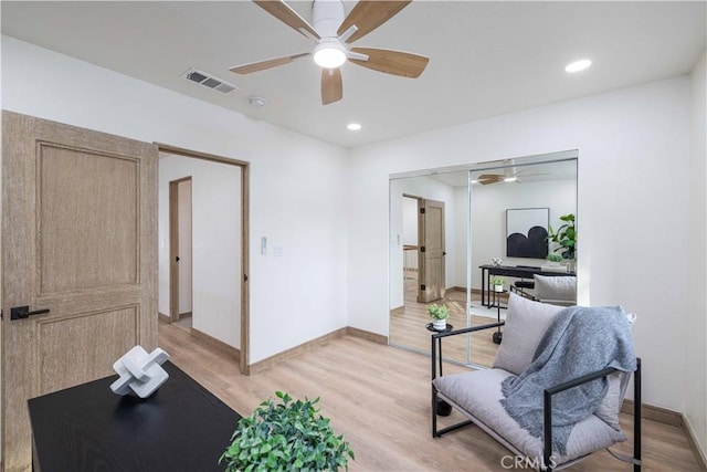 interior space featuring light hardwood / wood-style flooring and ceiling fan