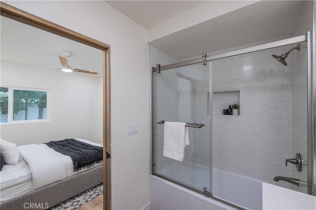 bathroom featuring shower / bath combination with glass door and ceiling fan