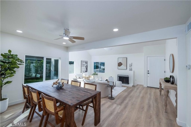 dining room featuring ceiling fan and light hardwood / wood-style flooring