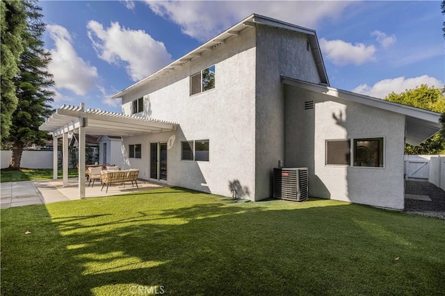 back of property with a yard, a pergola, central AC, and a patio