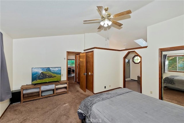 carpeted bedroom with multiple windows, lofted ceiling, and ceiling fan