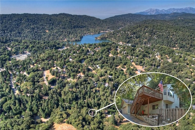 birds eye view of property featuring a water and mountain view