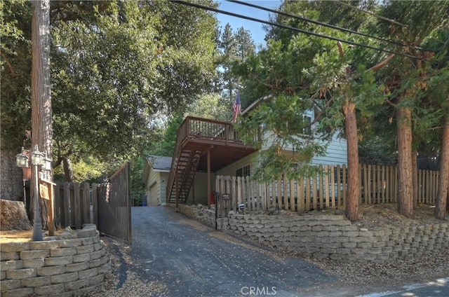 view of side of property with a wooden deck